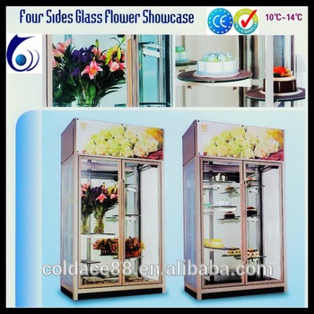 Glass flower display showcase with three doors