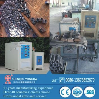 Induction heating machine for spring nuts